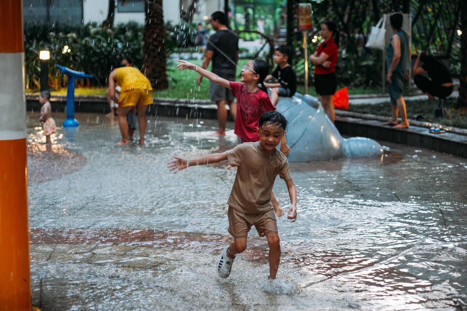 A child splashing through water on a sunny day